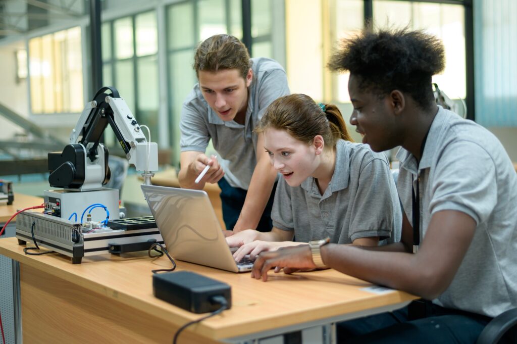 Trainee Robotics engineer learning with Programming Robot Hand