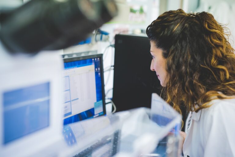 Female scientist using FTIR spectrophotometer, analyzing FTIR map