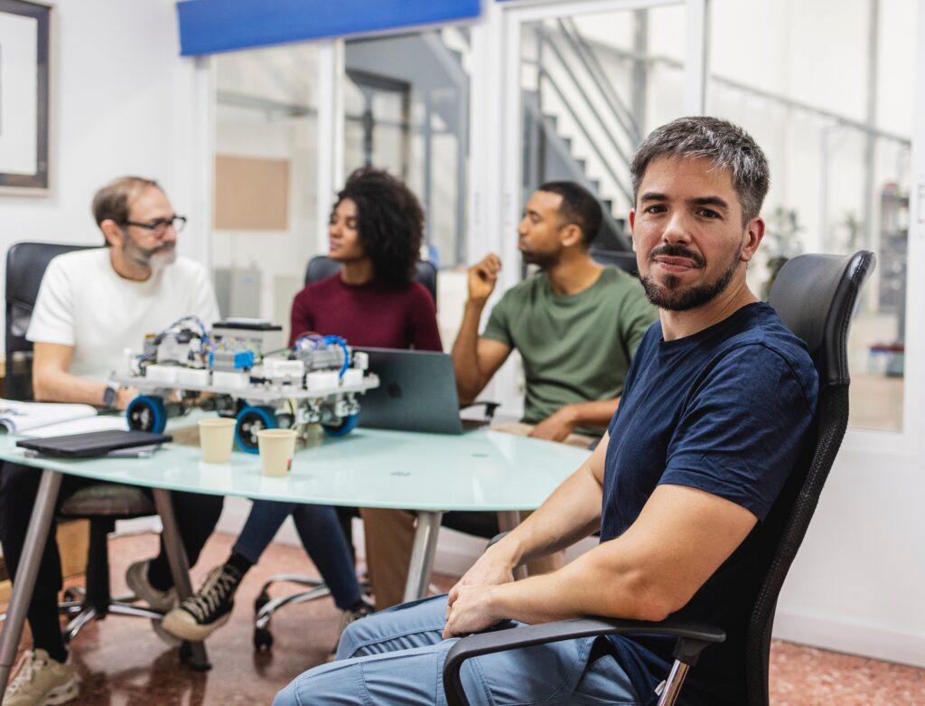 Robotics engineers developing innovative automation solutions in modern factory