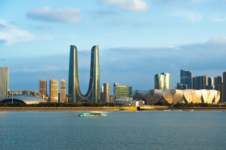 A large body of water with a city in the background