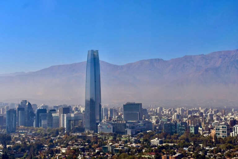a view of a city with mountains in the background
